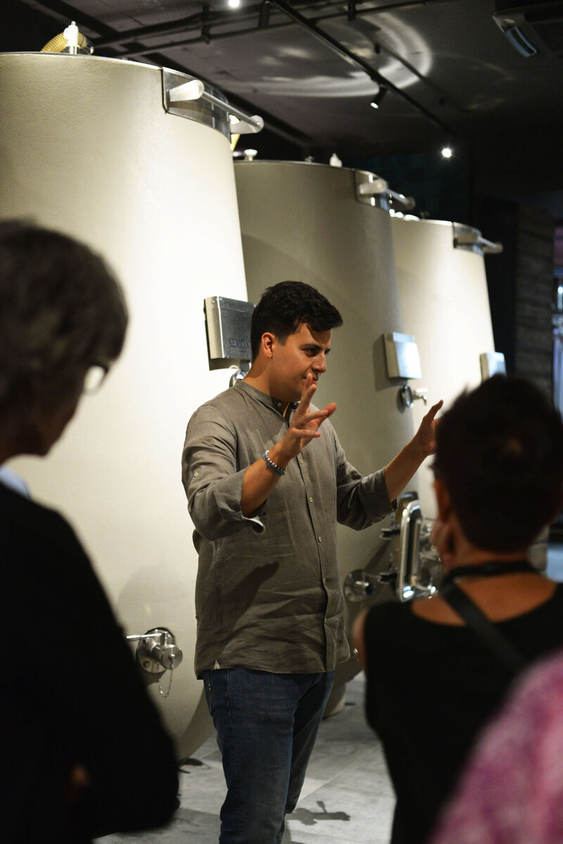 A local Italian expert speaking to a group On the Italian on Tour’s 10 day Italy Uncorked Small Group Tour