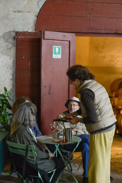 A small group of people enjoying a meal On the Italian on Tour’s 10 day Northern Italian Delights Food & Wine Tour