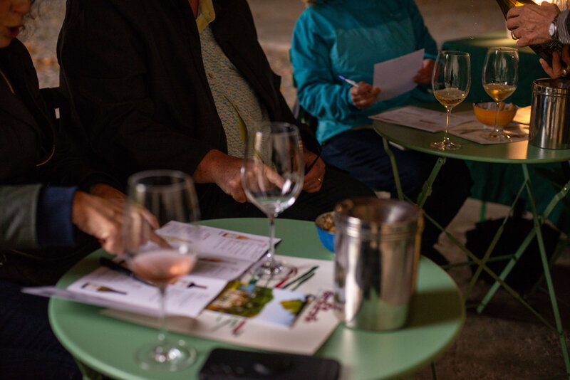A person browsing a menu with an empty glass of wine On the Italian on Tour’s 10 day Northern Italian Delights Food & Wine Tour