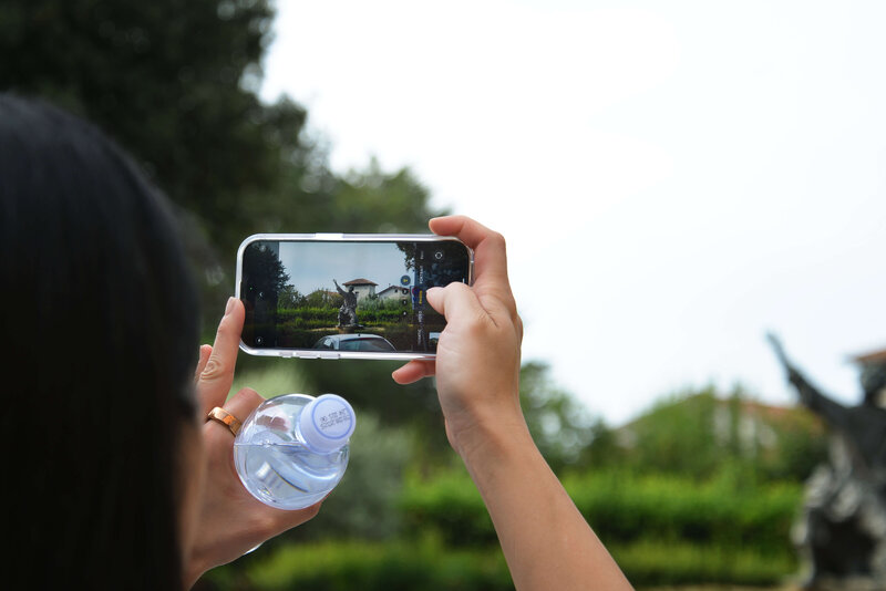 A person taking a scenic photo On the Italian on Tour’s 10 day Italy Uncorked Small Group Tour