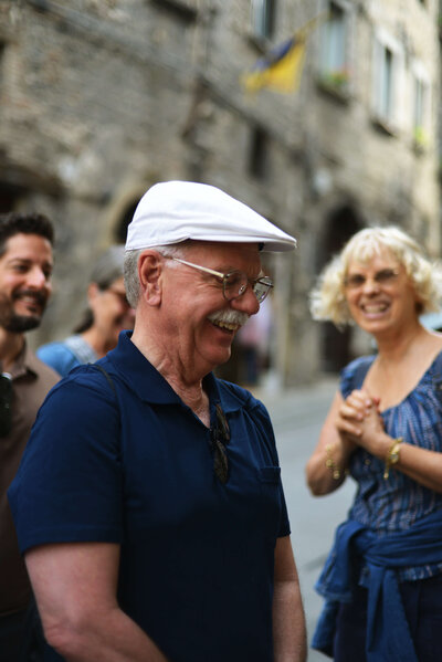 A group of people laughing On the Italian on Tour’s 10 day Italy Uncorked Small Group Tour