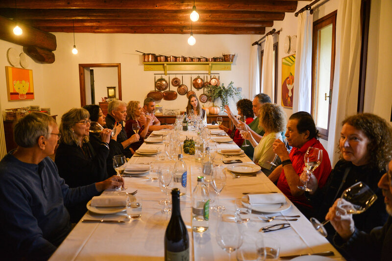 A small group of people dining together On the Italian on Tour’s 10 day Northern Italian Delights Food & Wine Tour