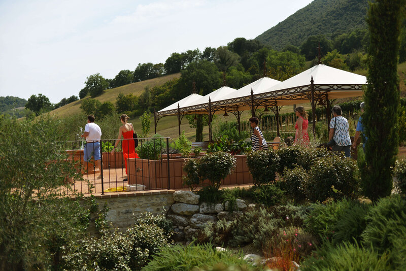 Tourists walking through a scenic garden On the Italian on Tour’s 10 day Italy Uncorked Small Group Tour