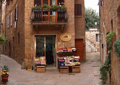 A picturesque Italian storefront with rustic charm and colorful goods, showcasing the appeal of tax-free shopping in Italy.